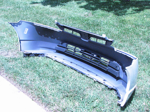 Bumper panel & grille assembly on the grass