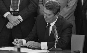 President Reagan (R) signs the Anti-Torture Treaty
